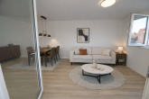 Helles Wohnzimmer - SICHER IM ALTER: Moderne 2-Zimmer-Wohnung mit Süd-Balkon und umfassendem Betreuungsangebot